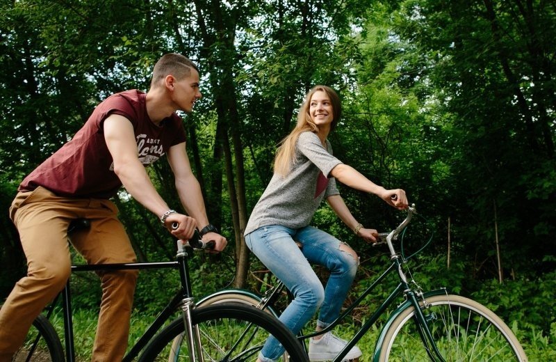 Couple bikes young happy couple cycling outdoors